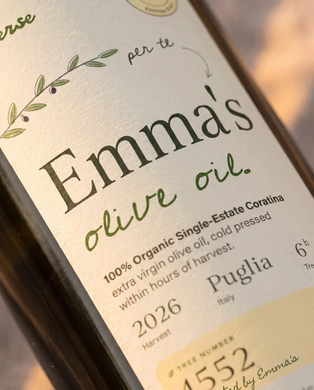 Close-up of a bottle label reading Emma’s olive oil